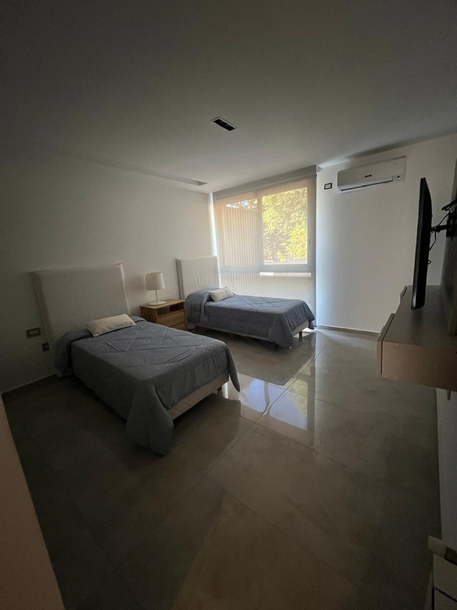 Fotografía de Habitaciones y Baños correspondiente a Casa_duplex en Barrio Villa Carlos Paz, Costa Azul Norte.