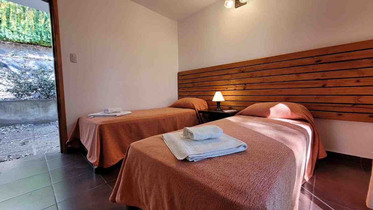 Fotografía de Habitaciones y Baños correspondiente a Hotel en Barrio Punilla, La Falda.